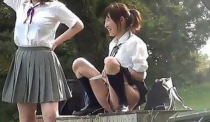 Immature Asian school girls feign with piss